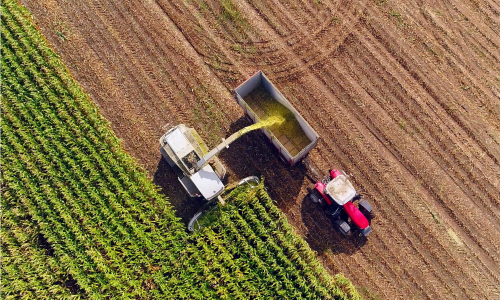 Tractor harvesting crops